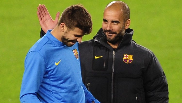 Gerard Piqué y Pep Guardiola en un entrenamiento del FC Barcelona en Liga de Campeones