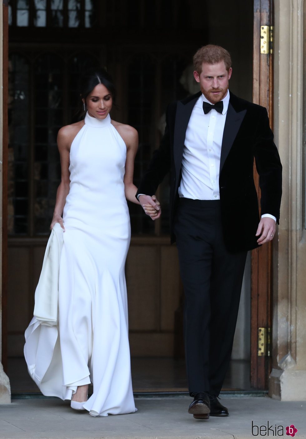 El Príncipe Harry y Meghan Markle saliendo del Castillo de Windsor tras su boda