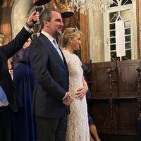 Nicolás de Grecia y Chrysi Vardinoyannis con la mano en el vientre durante su boda