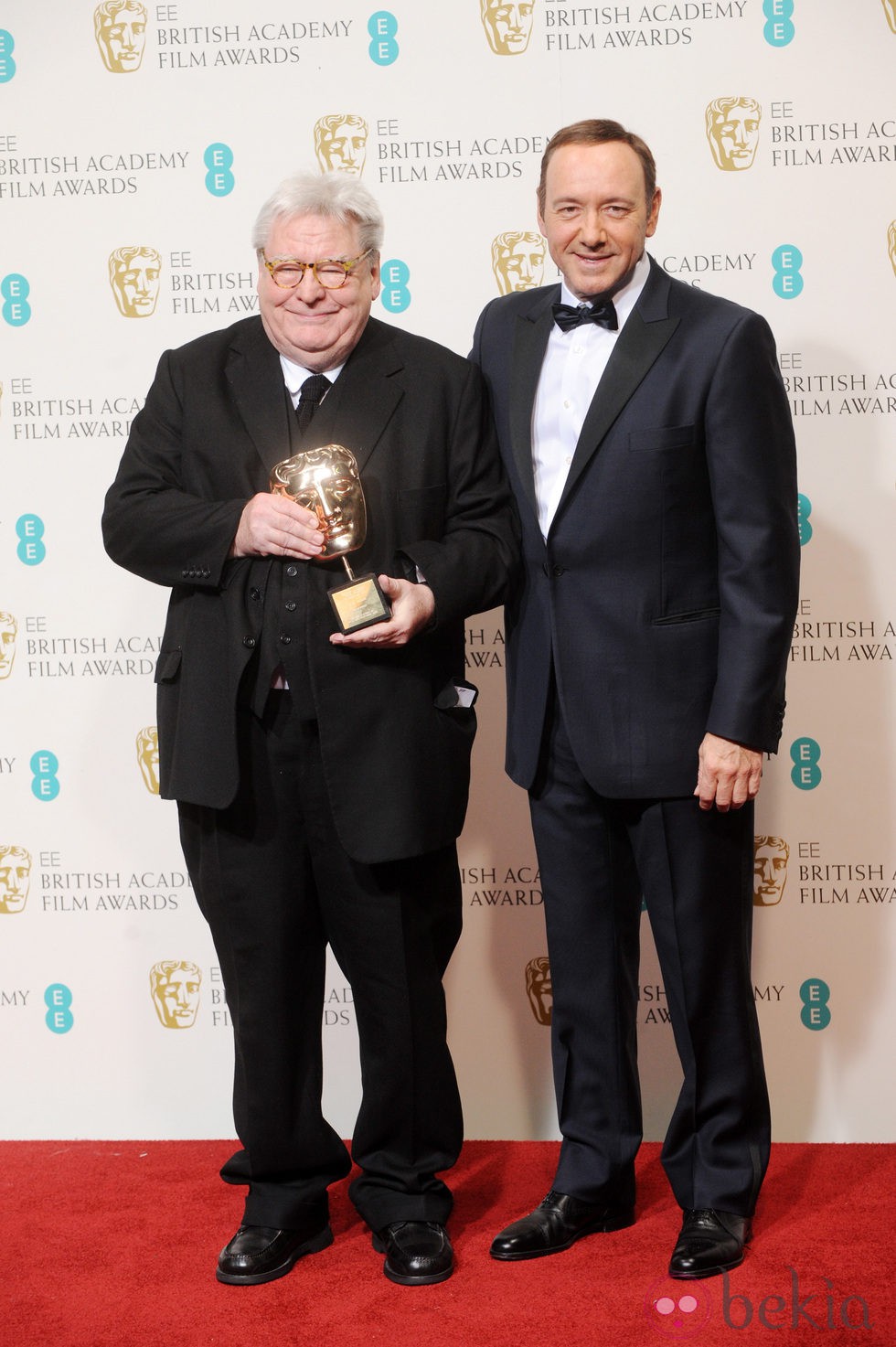 Alan Parker y Kevin Spacey en los BAFTA 2013