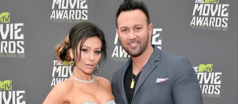 Jenni Farley y su prometido Roger Matthews en la alfombra roja de los MTV Movie Awards 2013