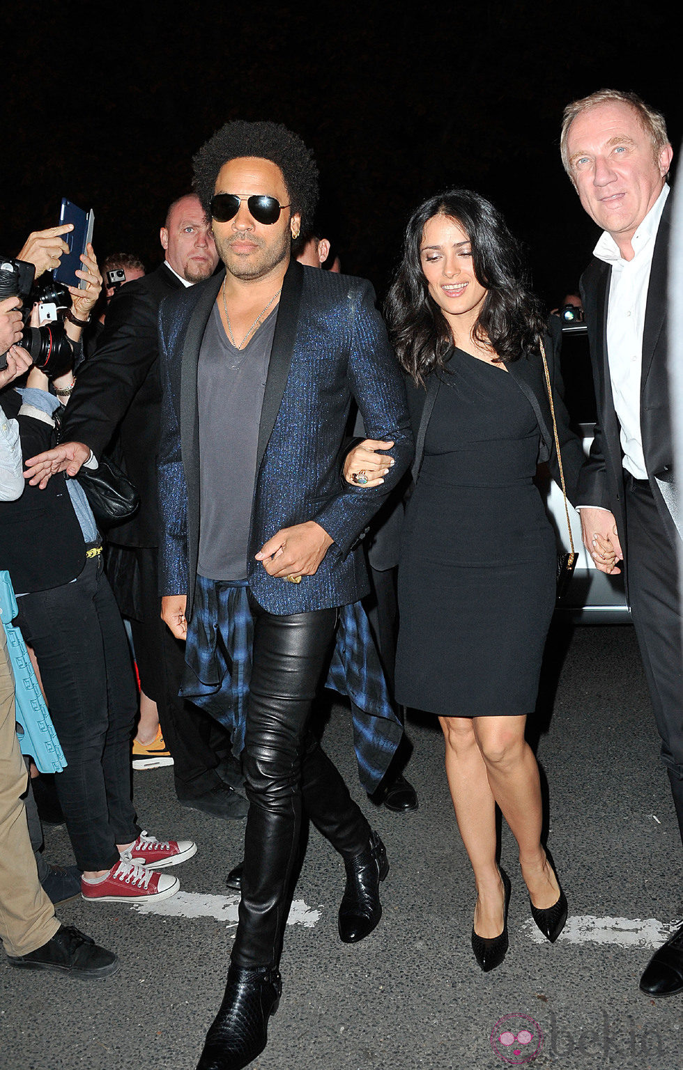 Lenny Kravitz y Salma Hayek en el desfile de Yves Saint Laurent en la Semana de la Moda de París primavera/verano 2014