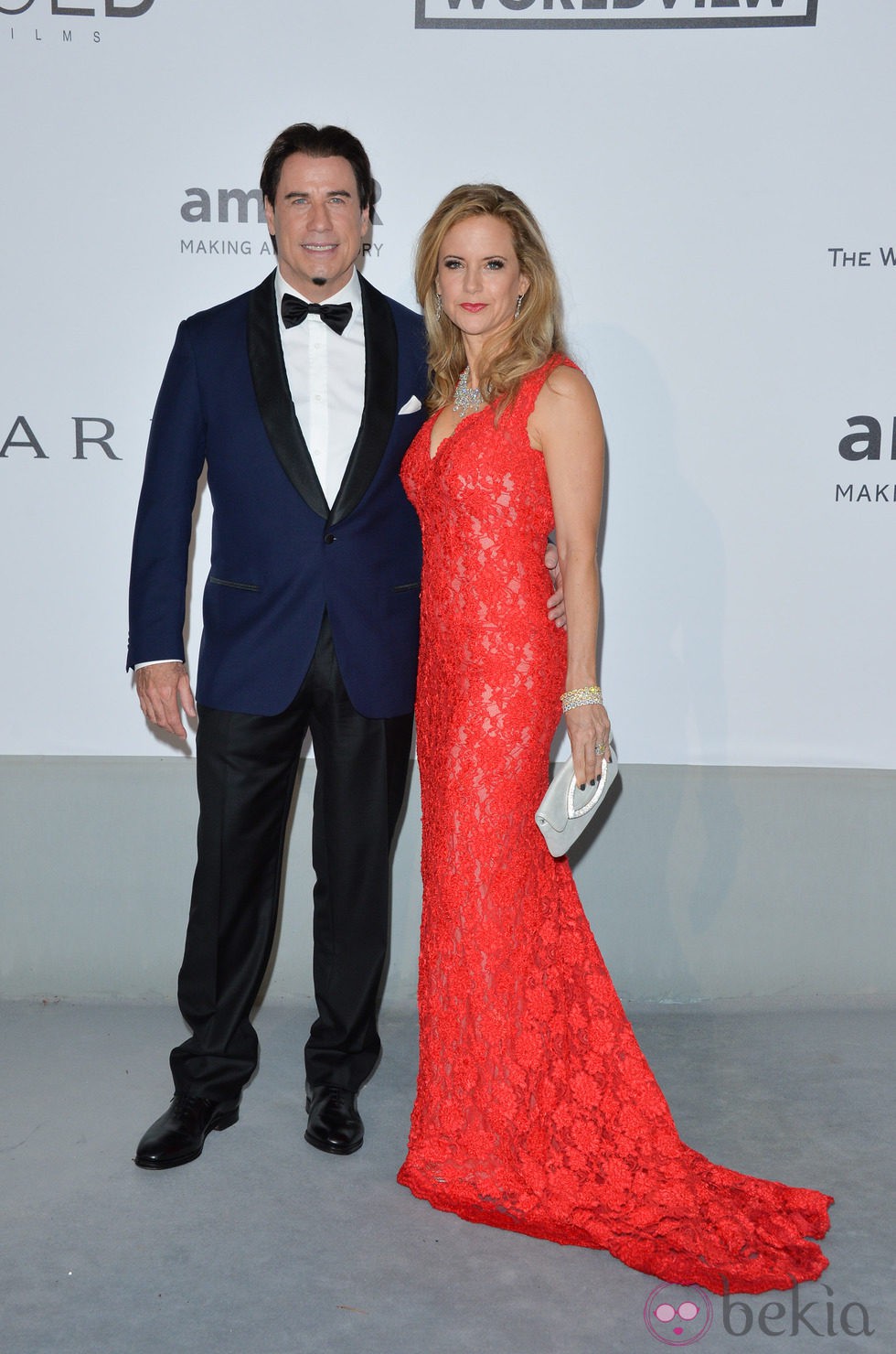 John Travolta y Kelly Preston en la gala amfAR del Festival de Cannes 2014