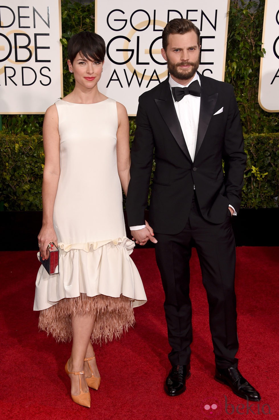 Jamie Dornan y Amelia Warner en la alfombra roja de los Globos de Oro 2015