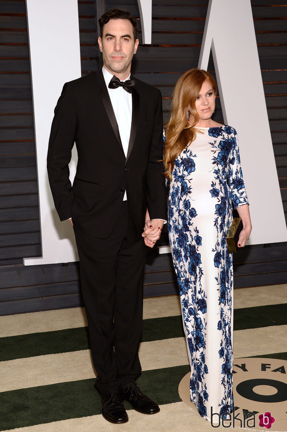 Sacha Baron Coen e Isla Fisher en la fiesta Vanity Fair tras los Oscar 2015