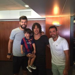 Gerard Piqué, Carles Puyol, Milan Piqué y Xavi Hernández