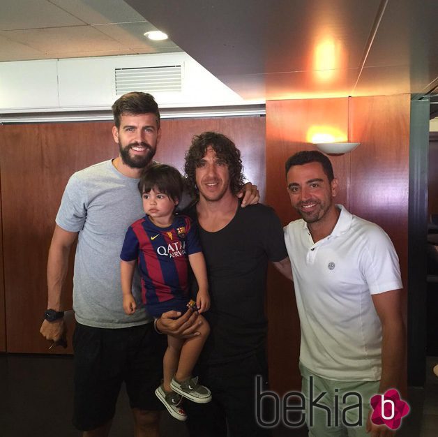 Gerard Piqué, Carles Puyol, Milan Piqué y Xavi Hernández