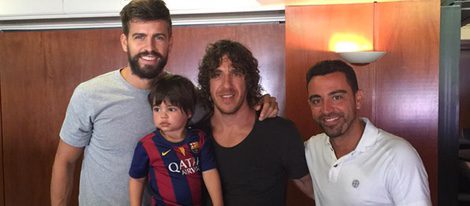 Gerard Piqué, Carles Puyol, Milan Piqué y Xavi Hernández